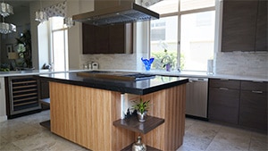 Bamboo Wood Style Island With Black Sparkled Quartz Countertop and Black Hood
