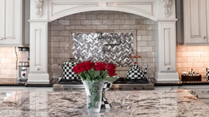 Traditional French-Chimney Style Covered Hood with Roses Vase in Kitchen