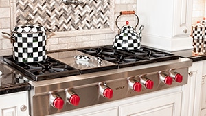 Checkered Kitchen Pot Set and Kettle on Cooktop
