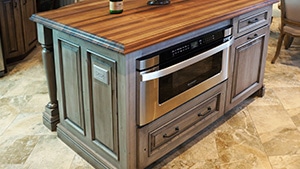 Washed Wood Kitchen Island With Soft Brown Countertop